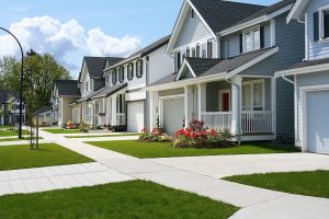 a line of traditional homes on a suburban street