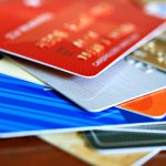 a close-up view of a colorful stack of credit cards